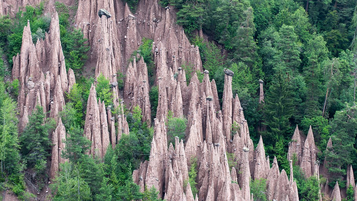 The 16 most breathtaking sites in northern Italy – including a ‘rainbow lake’, electricity-free theme park and pyramid-like rock formations emerging from the forest